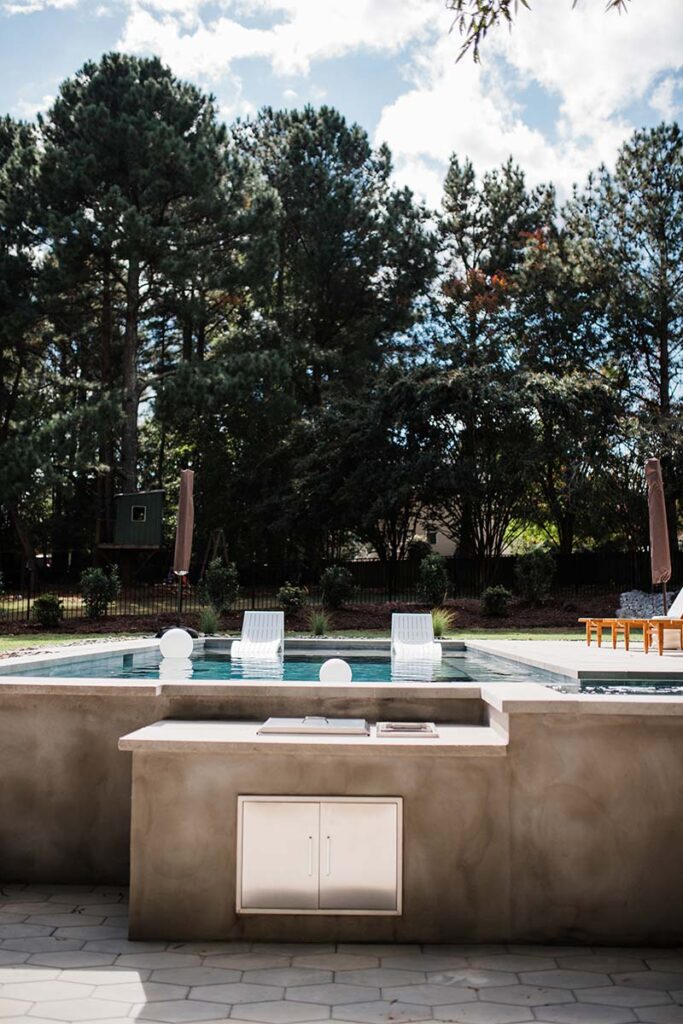 Direct view of outdoor kitchen showing Concrete Cray pool