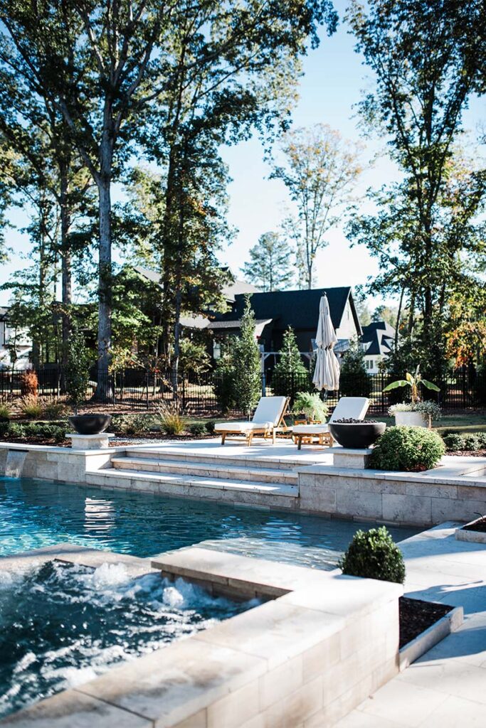 Contemporary Raleigh pool with patio deck leading into pool