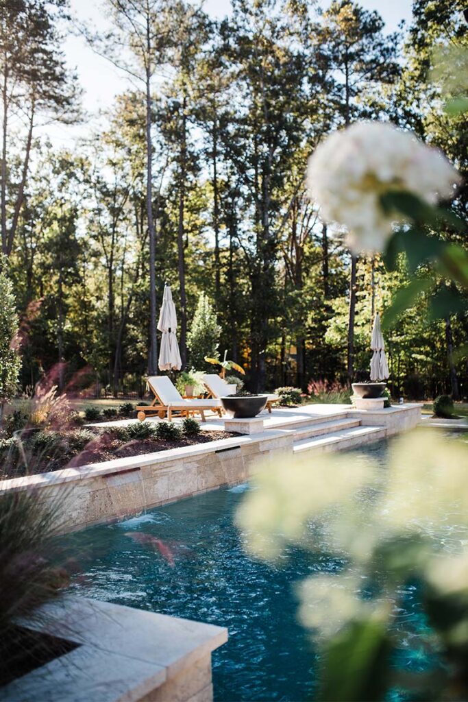 Close of out of focus flower with Contemporary Raleigh in the background