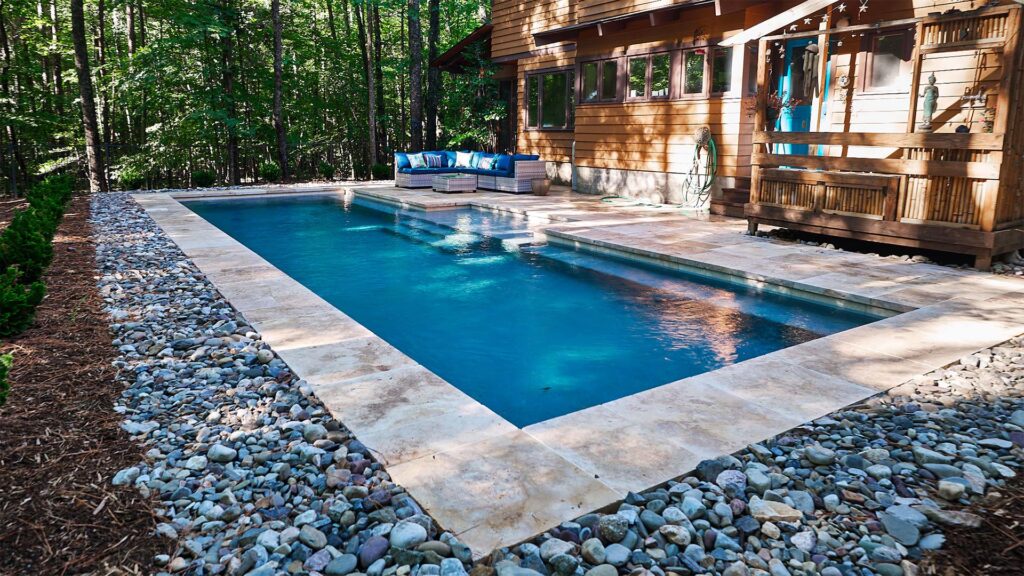 Custom Concrete pool in Chapel Hill, NC. Rustic Chapel Hill features custom concrete pool design walkways
